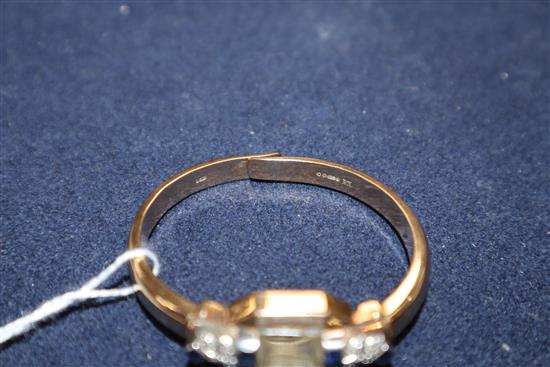 An Art Deco style 9ct gold, sapphire and diamond set bangle cocktail watch.